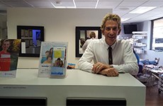 Dr. Howard at the reception desk